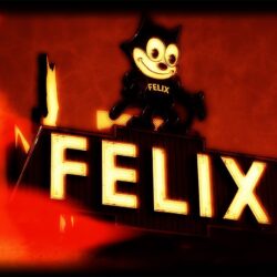 A vintage neon sign features a smiling cartoon cat character named "Felix" above large illuminated letters spelling "FELIX." The sign has a warm, nostalgic glow with reddish-orange hues in the background.