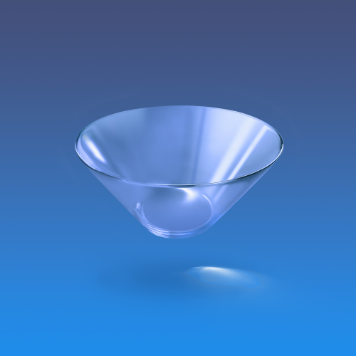 An empty clear glass martini glass against a blue gradient background.
