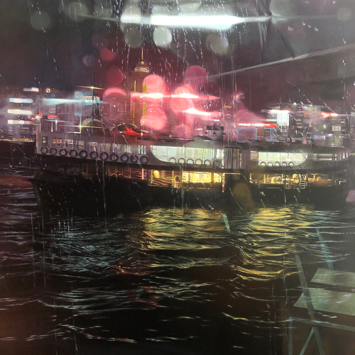 A ferry lit by neon lights is docked at night in the rain, with reflections shimmering on the choppy water and city buildings glowing in the background.