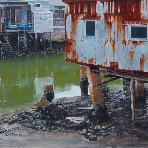 A rusty stilt house stands over greenish water and muddy ground, with weathered wooden steps and other old structures nearby. The scene looks worn and abandoned.