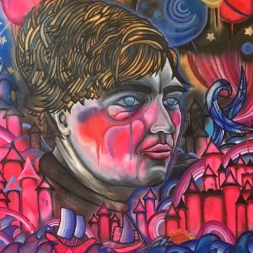 A stylized portrait of a person with a teardrop, surrounded by red castles, stylized waves, and celestial shapes in a vibrant, surreal painting.